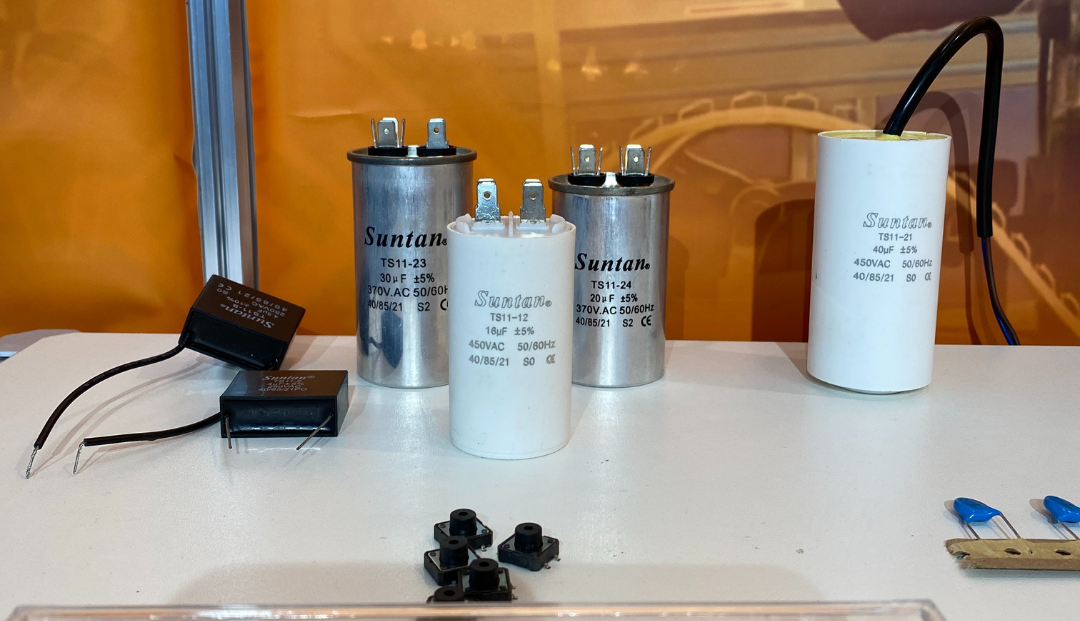 Suntan team discussion with visitor